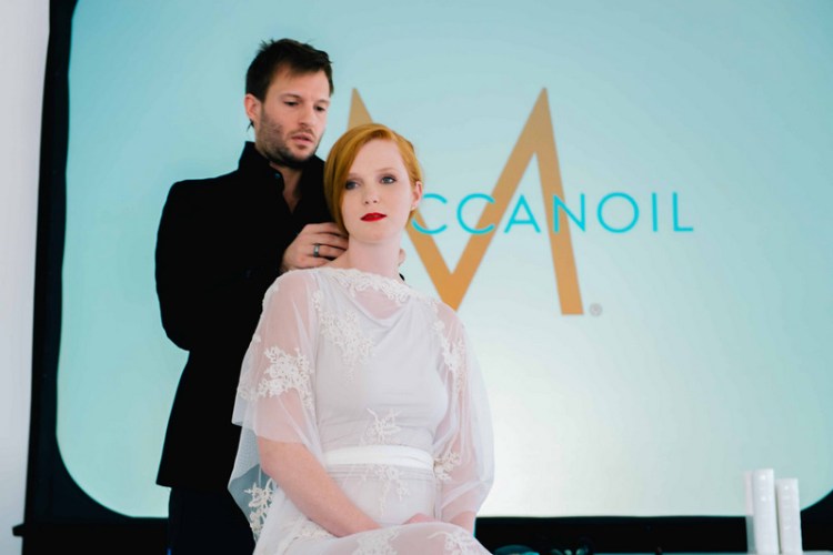 Moroccanoil's BLAH working his magic on a model at the launch