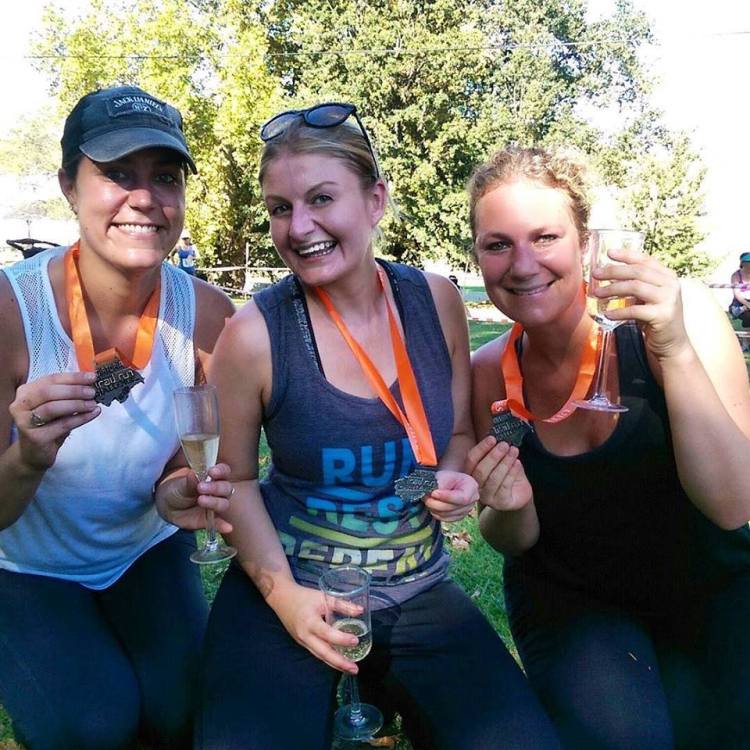 My merry shade of lobster is due to this being snapped minutes after I crossed the finish line. I'm not sunburned, I promise.